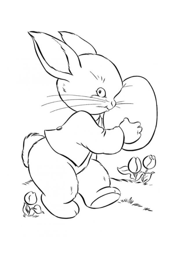 أرنب يحمل بيض عيد الفصح تلوين